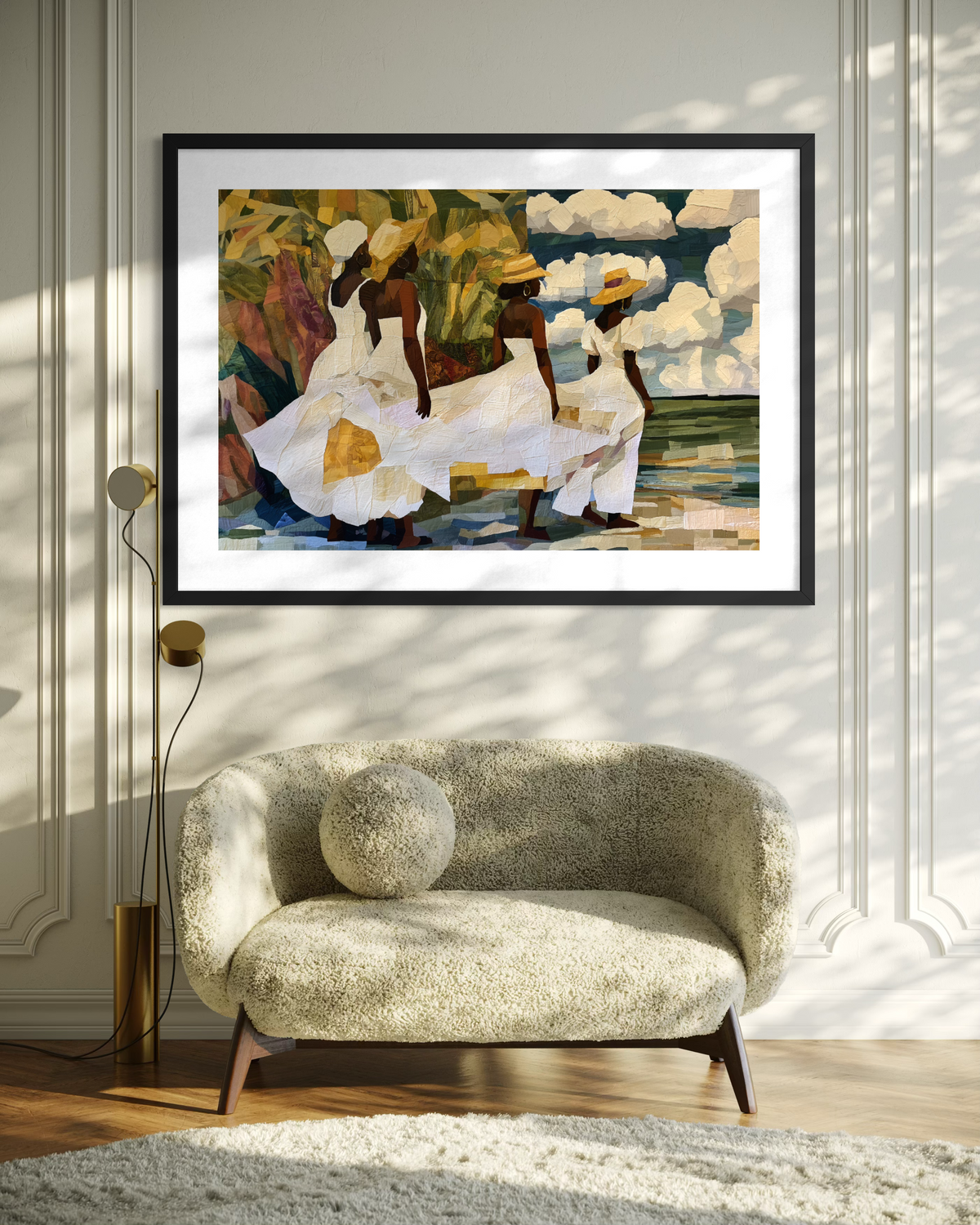 Framed fine art print depicting Afrocentric Gullah Geechee women dressed in white faux quilt-style patter dresses celebrating Black Low Country coastal heritage, African American ancestry, cultural traditions, family, community, and life rooted by the sea.  Displayed on a creme wall above a creme loveseat.