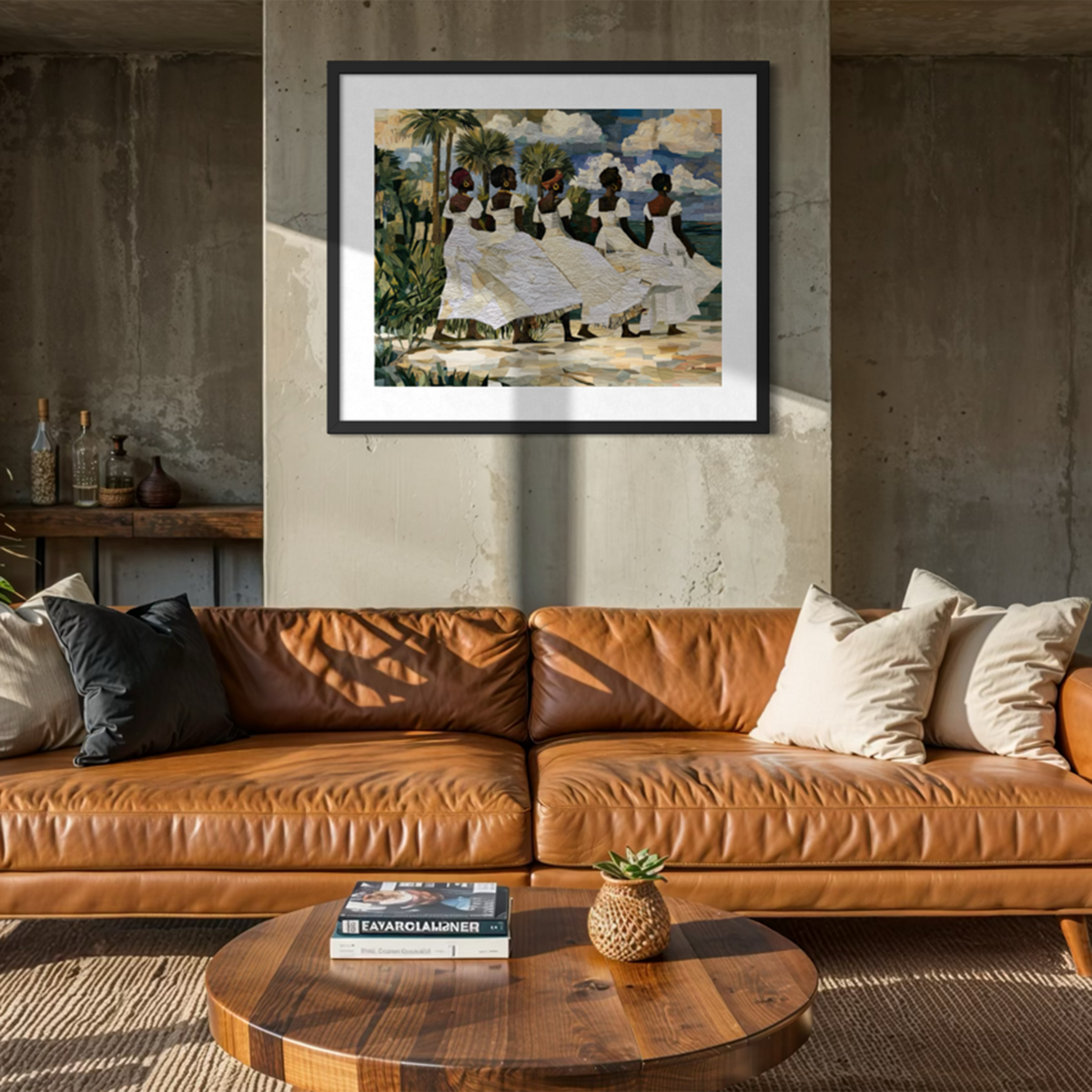 Framed fine art print depicting Afrocentric Gullah Geechee women dressed in white faux quilt-style pattern dresses celebrating Black Lowcountry coastal heritage, African American ancestry, cultural traditions, family, community, and life rooted by the sea.  Displayed on a concrete wall above a brown leather sofa in a modern living room setting.