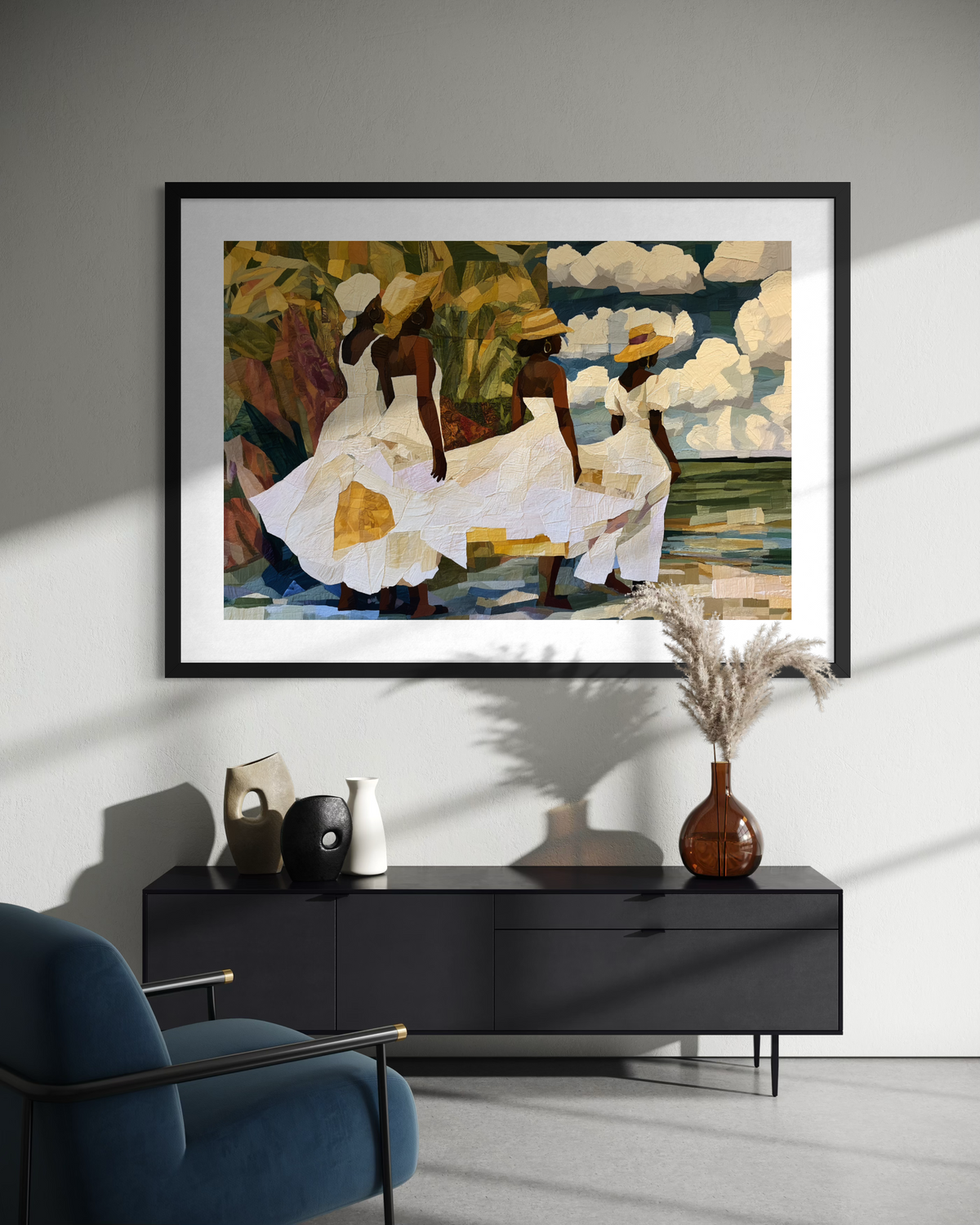Framed fine art print depicting Afrocentric Gullah Geechee women dressed in white faux quilt-style patter dresses celebrating Black Low Country coastal heritage, African American ancestry, cultural traditions, family, community, and life rooted by the sea.  Displayed on an off-white wall above a black console cabinet.