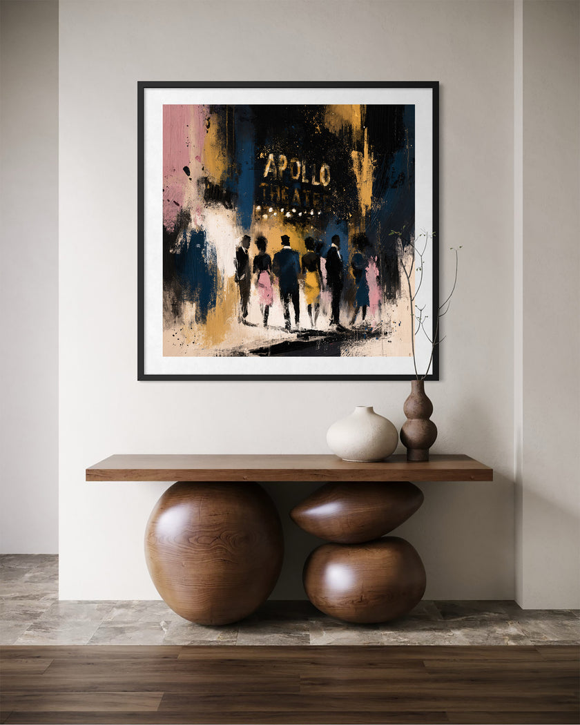 A framed abstract art print depicting silhouettes of people at night under the words 'APOLLO THEATRE', displayed on a wall above a wooden console table with decorative vases.