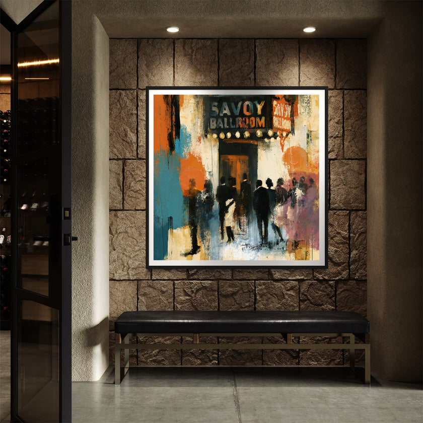 Framed art print of the historic Savoy Ballroom in Harlem displayed in a black frame with a white mat on a brown concrete brick wall with a black bench with recessed lighting.