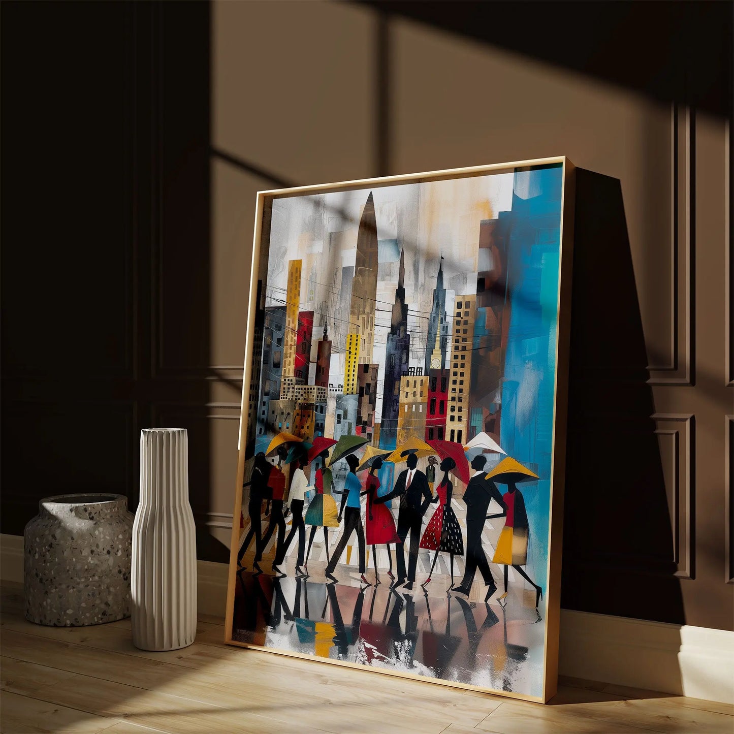 Abstract Afrocentric art print featuring Black silhouettes walking through rainy Manhattan streets with umbrellas and the New York City skyline in the background, displayed in a natural oak frame leaning against a warm brown wall as sunlight streams through a nearby window, casting soft shadows across the artwork.
