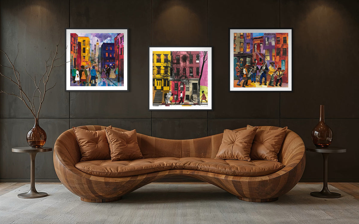 A modern curved brown leather sofa in a dark, stylishly decorated room, with three colorful framed paintings hanging on the dark wall above it.