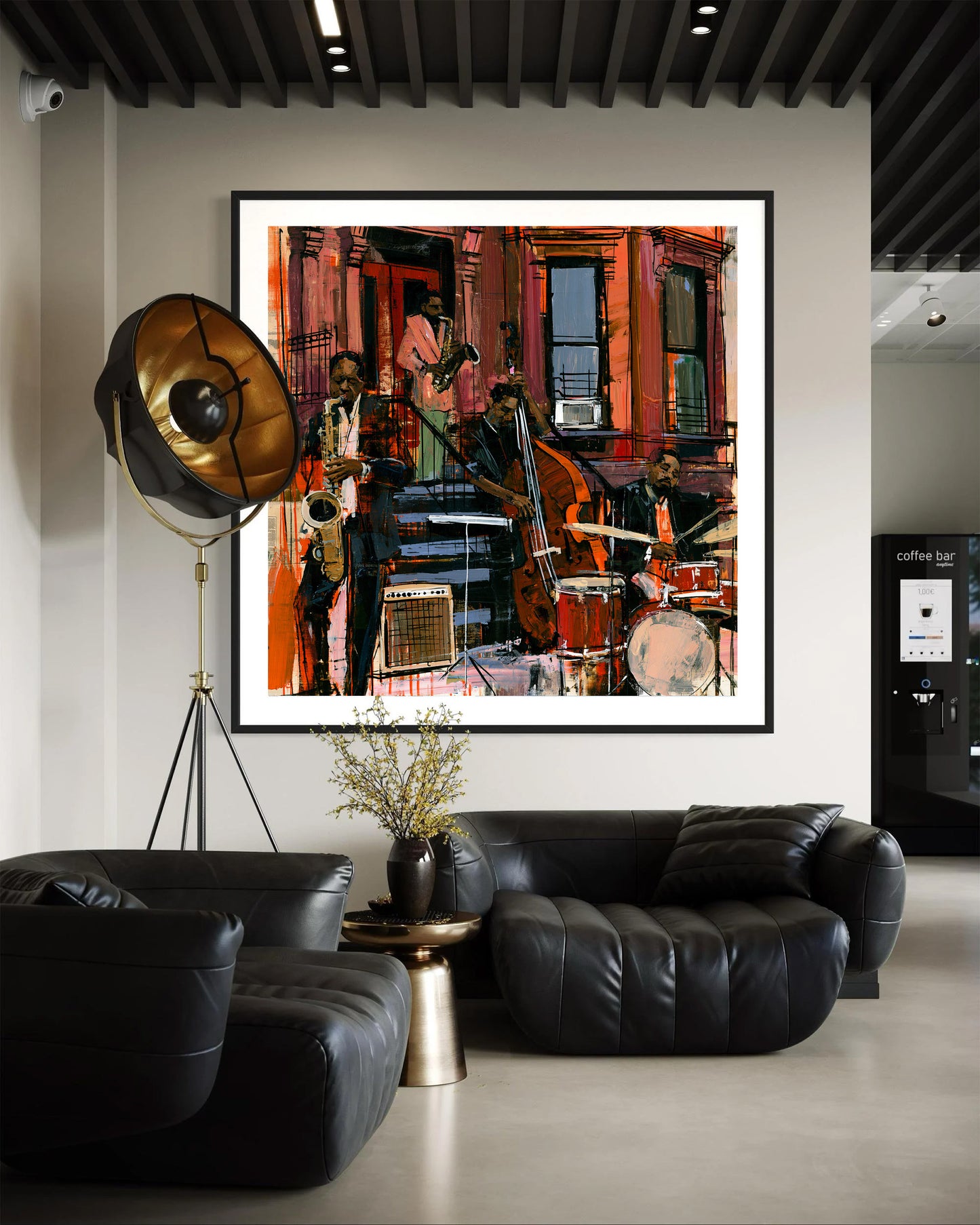 A framed abstract jazz music painting hangs on a beige wall above a black leather sofa.  The artwork features jazz musicians playing on the sidewalk in front of Harlem's historic brownstone buildings.