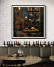 Harlem in the Moonlight Art Print featuring New York City yellow taxis at night under a glowing moon. Abstract Afrocentric Harlem cityscape wall art with vibrant colors and urban style.